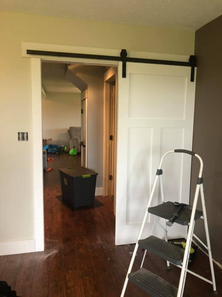 White shaker-style sliding barn door