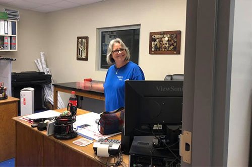Bluegrass front office team member at the front desk